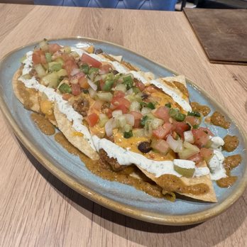 Proof Kitchen and Bar - Ox Tail Nacho Stack. A perfect and delicious portion. - Diners Near Me - Manassas, Virginia Proof Kitchen and Bar - Ox Tail Nacho Stack. A perfect and delicious portion. - Diners Near Me - Manassas, Virginia