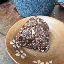 Dark chocolate covered marshmallow dusted with almonds.