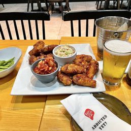 Soy Garlic & Korean BBQ wings with Edamame, Kimchi and Coleslaw sides. Ice cold large Asahi w frosty mug. "Addicted Yet?" Soy Garlic & Korean BBQ wings with Edamame, Kimchi and Coleslaw sides. Ice cold large Asahi w frosty mug. "Addicted Yet?"