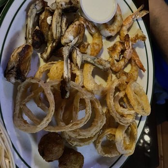 Floyd's Cajun Seafood - Cypress - Frog legs and shrimp with House-Cut Onion Rings - Cajun/Creole Near Me - Cypress, Texas