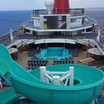 Carnival - Lido deck with water slide - Travel Services Near Me