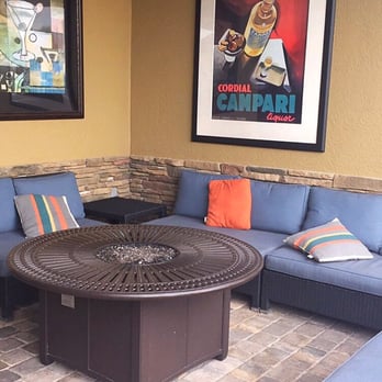 Stonewood Grill & Tavern - Fire pit and couch - New American Near Me - Ormond Beach, Florida Stonewood Grill & Tavern - Fire pit and couch - New American Near Me - Ormond Beach, Florida