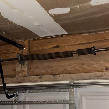 EJ’s Garage Door Repairs - This is the broken spring, before repairs. - Garage Door Services Near Me - San Antonio, Texas EJ’s Garage Door Repairs - This is the broken spring, before repairs. - Garage Door Services Near Me - San Antonio, Texas