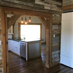 Knob and Keyhole Restorations - We used reclaimed siding to create a distressed wall in the mudroom, built the island with concrete counter tops and under mount sink.