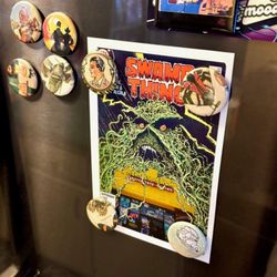 Heroes Realm - A complimentary Heroes Realm sticker--a parody of Alan Moore's Swamp Thing growing around the store--adorns my refrigerator.