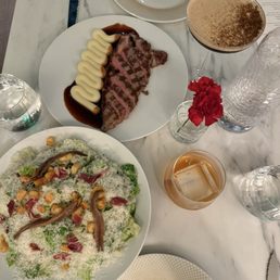 Pork entree & Caesar salad. Pork entree & Caesar salad.