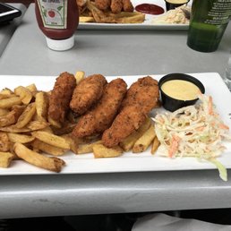 a plate of fried fish, fries and coleslaw a plate of fried fish, fries and coleslaw