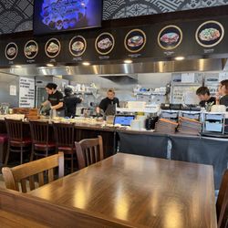 Open kitchen and dining area. I believe there are 5 seats to watch the chefs hard at work.