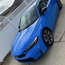 Ken Ganley Honda - 2026 Honda Civic Hybrid Hatchback Sport Touring - Boost Blue