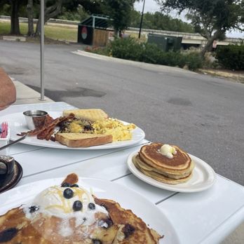 Blue Dog Bistro - Blueberry ricotta pancakes and the Blue Dog big breakfast on the outdoor patio - Coffee & Tea Near Me - Gulfport, Mississippi