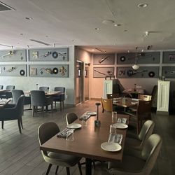 Tap & Bitters - Dining area with instruments on the wall