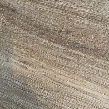 Ashley Store - Damaged flooring - Furniture Stores Near Me - Fresno, California
