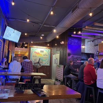 Luchador Madison - Big tall tables next to a big tall bar. - Mexican Near Me - Madison, Wisconsin