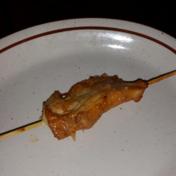 Krua Thai Cafe - a chicken skewer on a white plate - Thai Near Me - Dallastown, Pennsylvania Krua Thai Cafe - a chicken skewer on a white plate - Thai Near Me - Dallastown, Pennsylvania