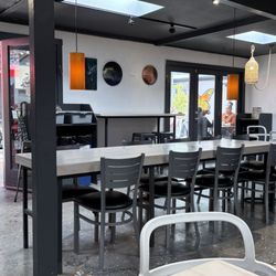 Interior: Indoor seating, communal table, Frida Kahlo mural