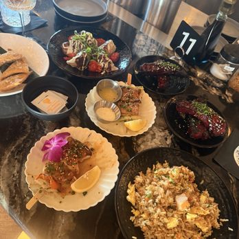 The Moderne - Seabass skewer $12; snapper skewer $12; sticky ribs $8; shrimp and crab gyoza $14 - Tapas/Small Plates Near Me - Orlando, Florida The Moderne - Seabass skewer $12; snapper skewer $12; sticky ribs $8; shrimp and crab gyoza $14 - Tapas/Small Plates Near Me - Orlando, Florida
