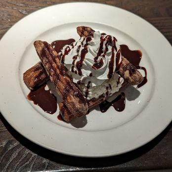 Mama Tigre - Churros, Rolled in Cinnamon Sugar with Vanilla bean ice cream, caramel, chocolate syrup, whipped cream - Mexican Near Me - Oakton, Virginia