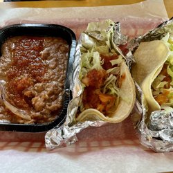 Taco Del Mar - Two chicken tacos and beans.