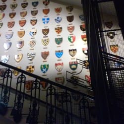 East India Club - The wall of many school crests!
