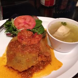 a plate of lasagna and a bowl of soup