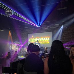 a group of people sitting at a bar a group of people sitting at a bar