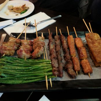 Ke Zhang - Lots of skewers: chive, bacon wrapped mushrooms, beef, fish tofu, and fried rice cake. Yum. - Chinese Near Me - Flushing, New York Ke Zhang - Lots of skewers: chive, bacon wrapped mushrooms, beef, fish tofu, and fried rice cake. Yum. - Chinese Near Me - Flushing, New York