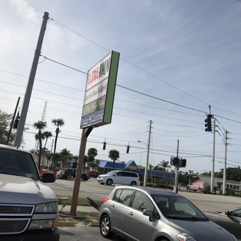 Slide Inn - cars parked in a parking lot - Dive Bars Near Me - Cape Canaveral, Florida Slide Inn - cars parked in a parking lot - Dive Bars Near Me - Cape Canaveral, Florida