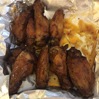 Pig on a Pie - Pic after I had the first 2 wings.  Amazing. Mango Habanero in the back and Sweet Red Chili in the front. - Pizza Near Me - Macon, Georgia