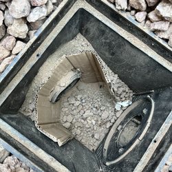 Mirage Landscaping & Construction - This drain has so many things wrong with it. But the obvious thing is the fact they used cardboard to hold the pipe.