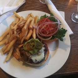 Santé Bar And Grille - "The Gondola" burger. Swiss cheese, jalapeño, guacamole, lettuce, tomato, and onions served with fries.
