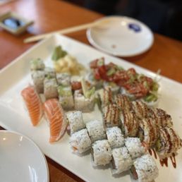 a plate of sushi and chopsticks a plate of sushi and chopsticks