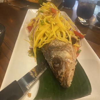 Spicy Shallot - while fish with mango salad. - Thai Near Me - Elmhurst, New York Spicy Shallot - while fish with mango salad. - Thai Near Me - Elmhurst, New York