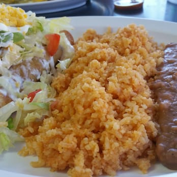 Dos Hermanos - Chicken flautas with avocados, tomatoes, lettuce, sour cream and Spanish rice with beans. The side of red salsa is very spicy and delicious! - Mexican Near Me - San Miguel, California Dos Hermanos - Chicken flautas with avocados, tomatoes, lettuce, sour cream and Spanish rice with beans. The side of red salsa is very spicy and delicious! - Mexican Near Me - San Miguel, California