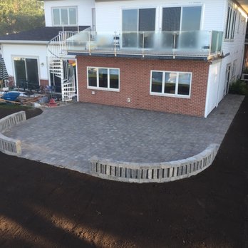 KF Lawn Service - a brick patio being laid in front of a house - Landscaping Near Me - Portage, Michigan KF Lawn Service - a brick patio being laid in front of a house - Landscaping Near Me - Portage, Michigan