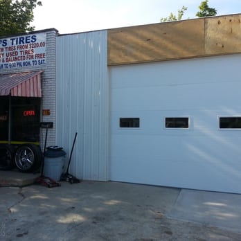 Over And Above Garage Doors - This is a commercial garage door installed at a used tire shop. - Garage Door Services Near Me - Columbus, Ohio Over And Above Garage Doors - This is a commercial garage door installed at a used tire shop. - Garage Door Services Near Me - Columbus, Ohio