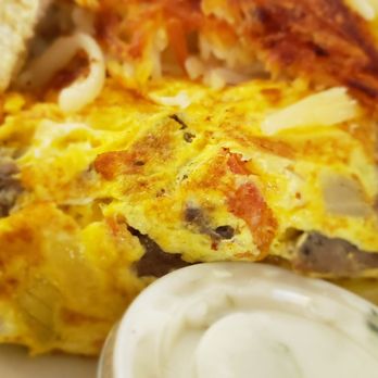 Omicron Family Restaurant - an omelet with bacon and mushrooms - American Near Me - West Bend, Wisconsin Omicron Family Restaurant - an omelet with bacon and mushrooms - American Near Me - West Bend, Wisconsin