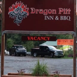 Our trucks through the Dragon Pitt Inn & BBQ sign. Our trucks through the Dragon Pitt Inn & BBQ sign.