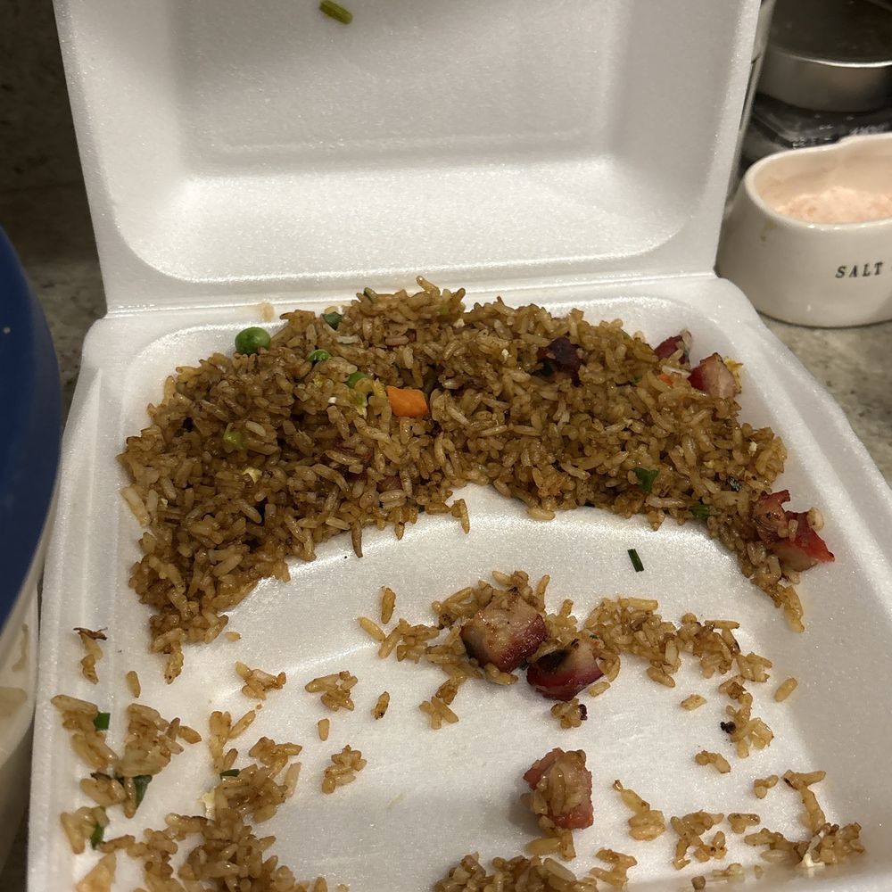 Half gone Pork Fried Rice, because I eat it in the car is was so good!