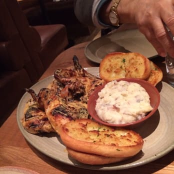 Nando's Peri-Peri - Full platter with sides of garlic bread & mashed potatoes - Portuguese Near Me - Arlington, Virginia Nando's Peri-Peri - Full platter with sides of garlic bread & mashed potatoes - Portuguese Near Me - Arlington, Virginia