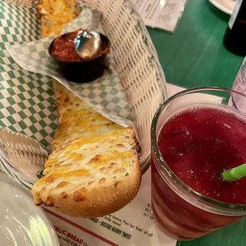 Oregano's - That amazing cheese garlic bread and this Bellini drink I think, sooo good. - Pizza Near Me - Flagstaff, Arizona