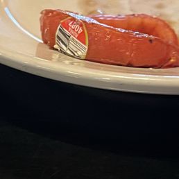 Produce sticker on the cooked tomato Produce sticker on the cooked tomato