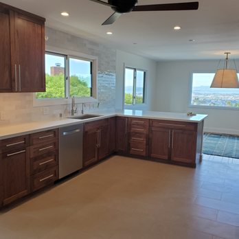 Artifex Construction - a kitchen with a ceiling fan - General Contractors Near Me