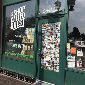 A Shop Called Quest - Sticker bombed door entry - Comic Books Near Me - Redlands, California A Shop Called Quest - Sticker bombed door entry - Comic Books Near Me - Redlands, California