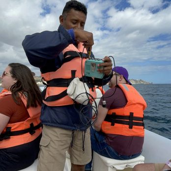 Cabo Adventures - Razz, our guide, with hydrophone to hear the whales. - Boat Tours Near Me - Cabo San Lucas, BCS Cabo Adventures - Razz, our guide, with hydrophone to hear the whales. - Boat Tours Near Me - Cabo San Lucas, BCS