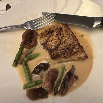The Capital Grille - Pan-Seared Sea Bass with Shiitake Mushrooms, Asparagus and Miso Butter - Steakhouses Near Me - Jacksonville, Florida