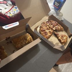 Domino's Pizza - What we got, I give 2 stars cause the food was good. Just come on bro with the other shit.