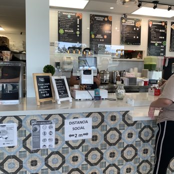 Frutas 100% Natural -  a woman standing at a counter - Sandwiches Near Me - Chula Vista, California