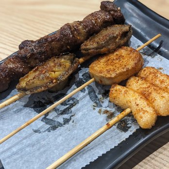 L.O.L BBQ & BAR - Beef skewer, abalone, 1/3 of a king mushroom skewer and rice cakes - Barbeque Near Me - Great Neck, New York