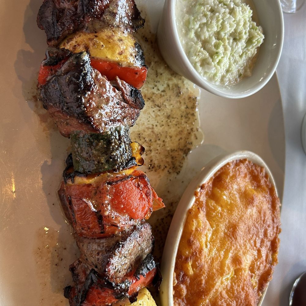 Steak on a stick with vegetables, macaroni N' cheese, Cole slaw Steak on a stick with vegetables, macaroni N' cheese, Cole slaw