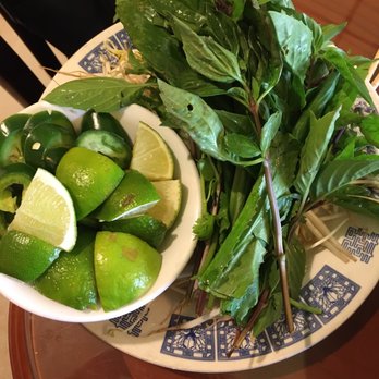 Pho Vinh - Lush fresh veggies and toms of limes which is awesome I hate when they give you one! - Vietnamese Near Me - Orlando, Florida